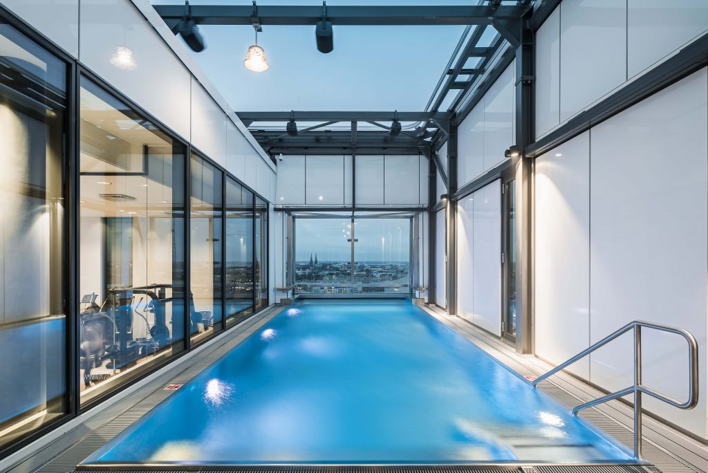 Hotel Swimming Bath Pool Refurbishment Commercial UK Stainless Steel Lap Competitive Indoor Swimming Pools UK Competitive Swimmer Design Installation Company Luxury Bespoke Infinity Indoor Outdoor Engineered Made to Measure Level Deck Skimmer Private Whirlpool One Piece Steam Sauna Rooms