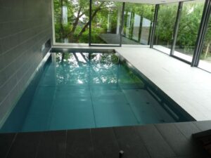 Stainless Steel Swimming Pools UK Luxury Bespoke Hotel Swimming Bath Refurbishment Commercial Infinity Indoor Outdoor Engineered Made to Measure Level Deck Skimmer Private Whirlpool One Piece Competitive Swimmer Lap Steam Sauna Rooms Wading Plunge